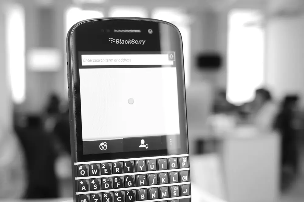 Black BlackBerry Q10 with a physical QWERTY keyboard below the screen