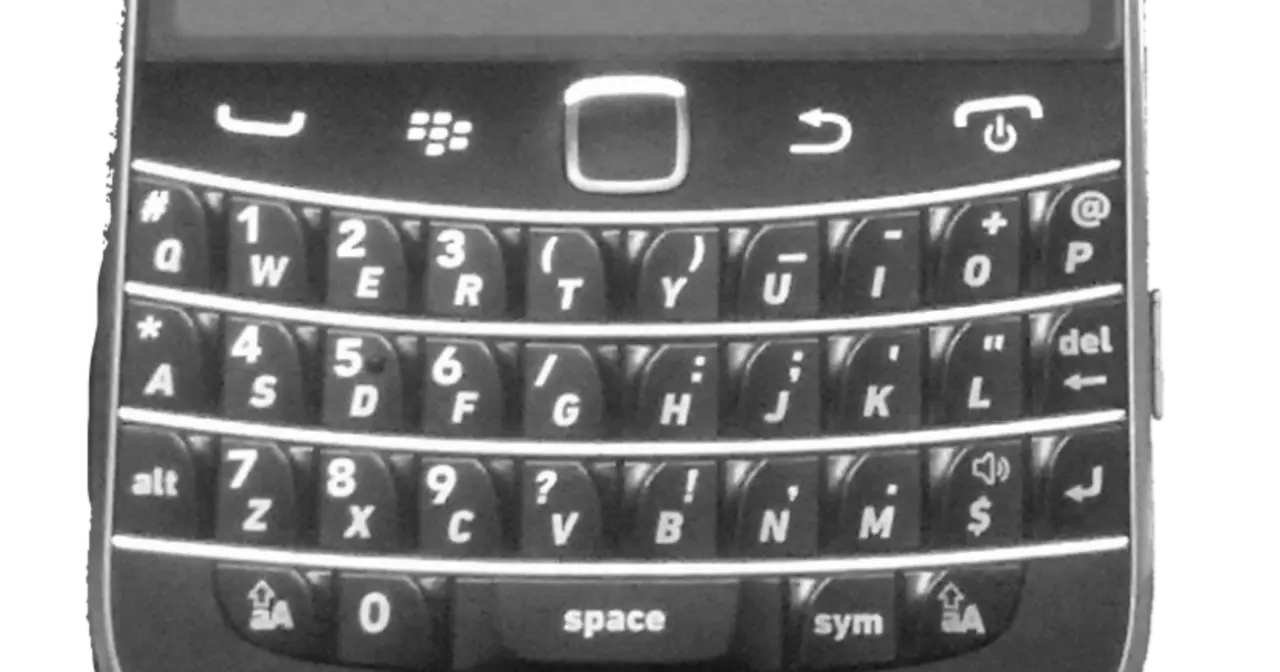 Black BlackBerry Bold 9900 smartphone with physical QWERTY keyboard, front view