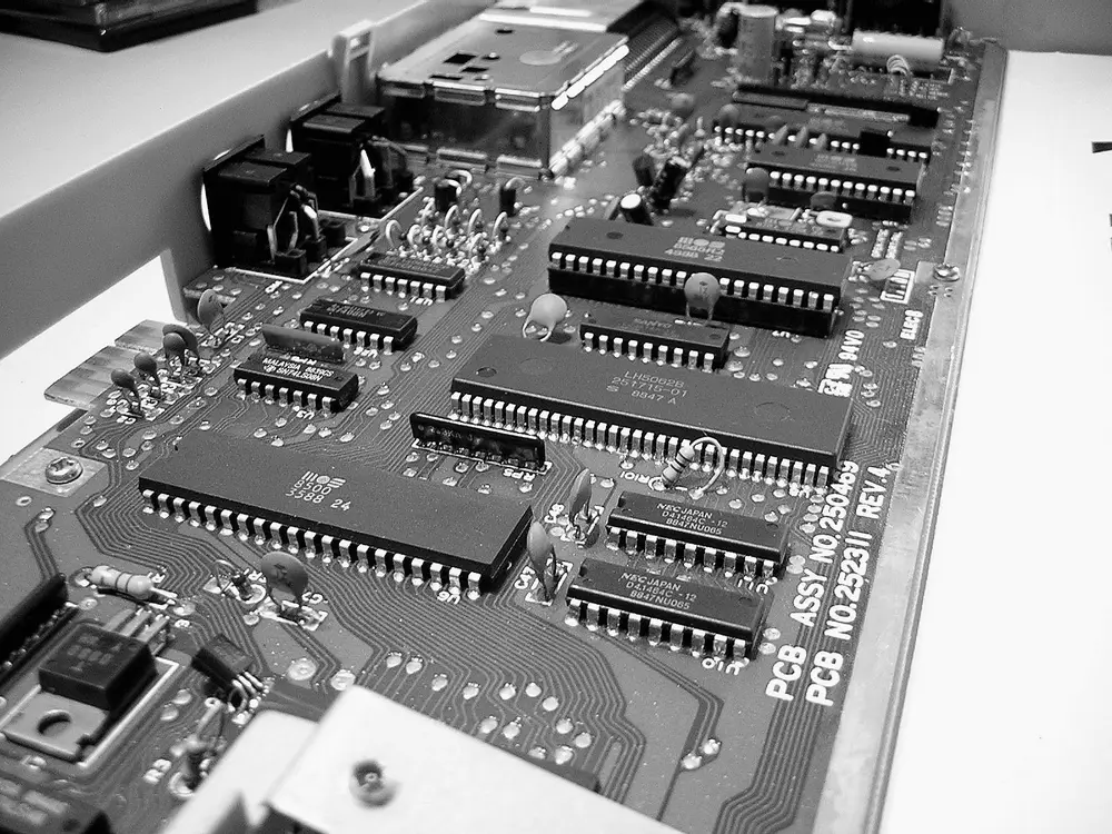 Commodore 64C motherboard with its integrated circuits and chips on view