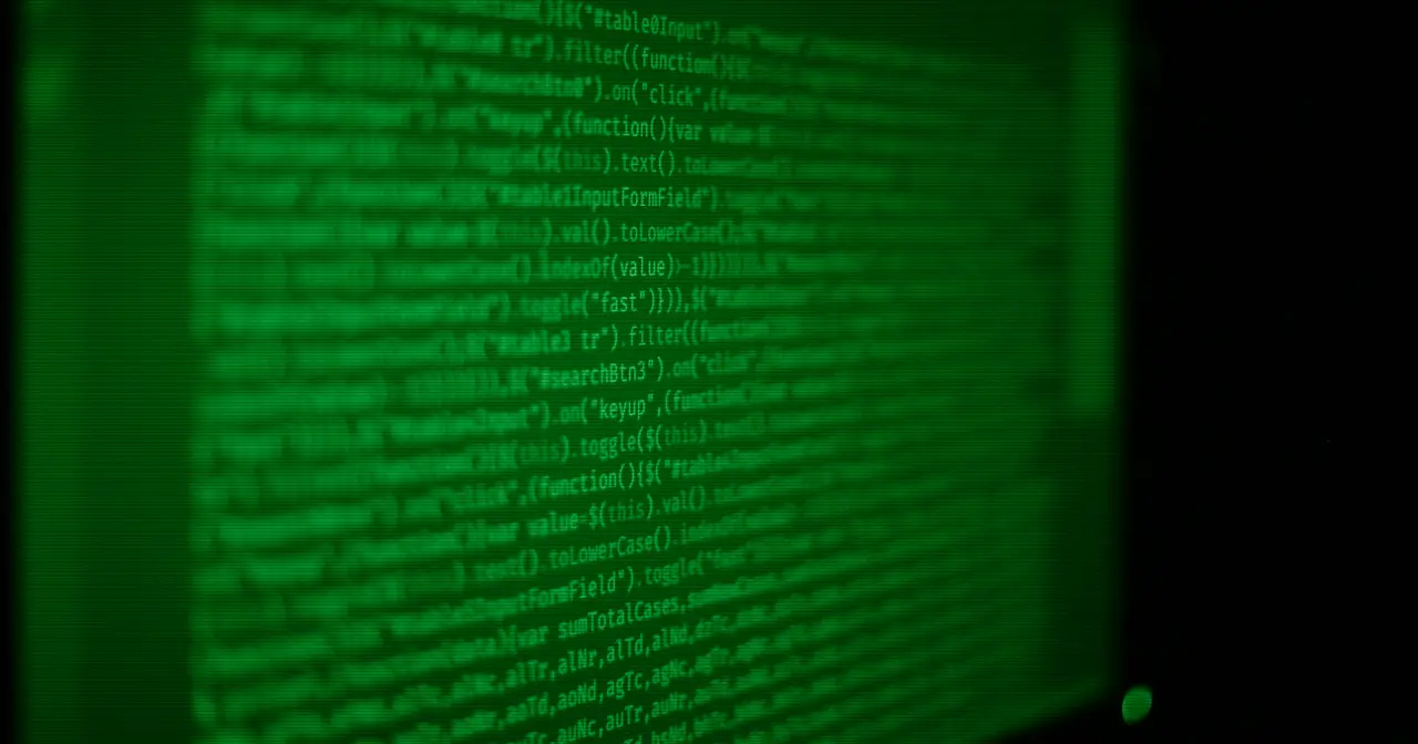 Screen full of code and a terminal, symbolizing the free software behind Linux distributions
