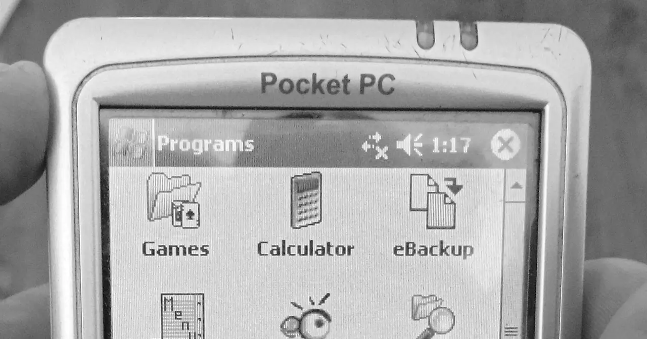 Mio 168 DigiWalker PDA running Windows Mobile 2003 showing the Programs menu on screen
